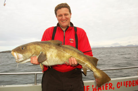 Gary Ryan with a 15 lbs Cod taken on a jelly worm
