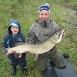 John and his helper with his 27lb pike