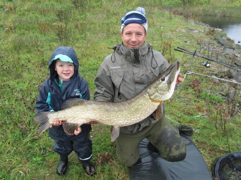 John and his helper with his 27lb pike