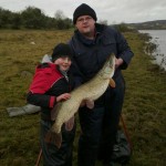 Aaron Murray with his 21lb 6oz pike and club chairman David Shannon