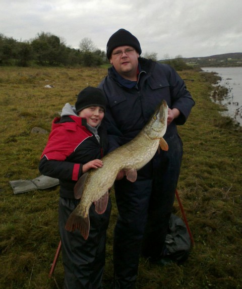 Aaron Murray with his 21lb 6oz pike and club chairman David Shannon