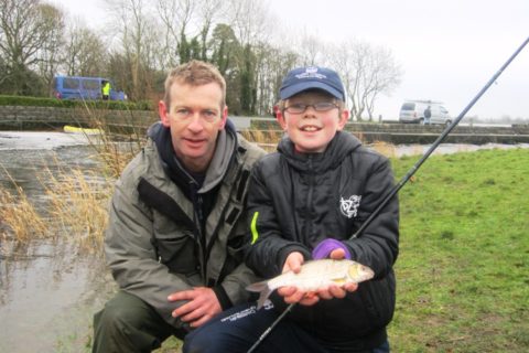 Des Chew of the Dublin Angling Initiative and Tommy Duff aged 11 with a hybrid from Lough Ramor