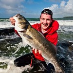 Bass with man at sea