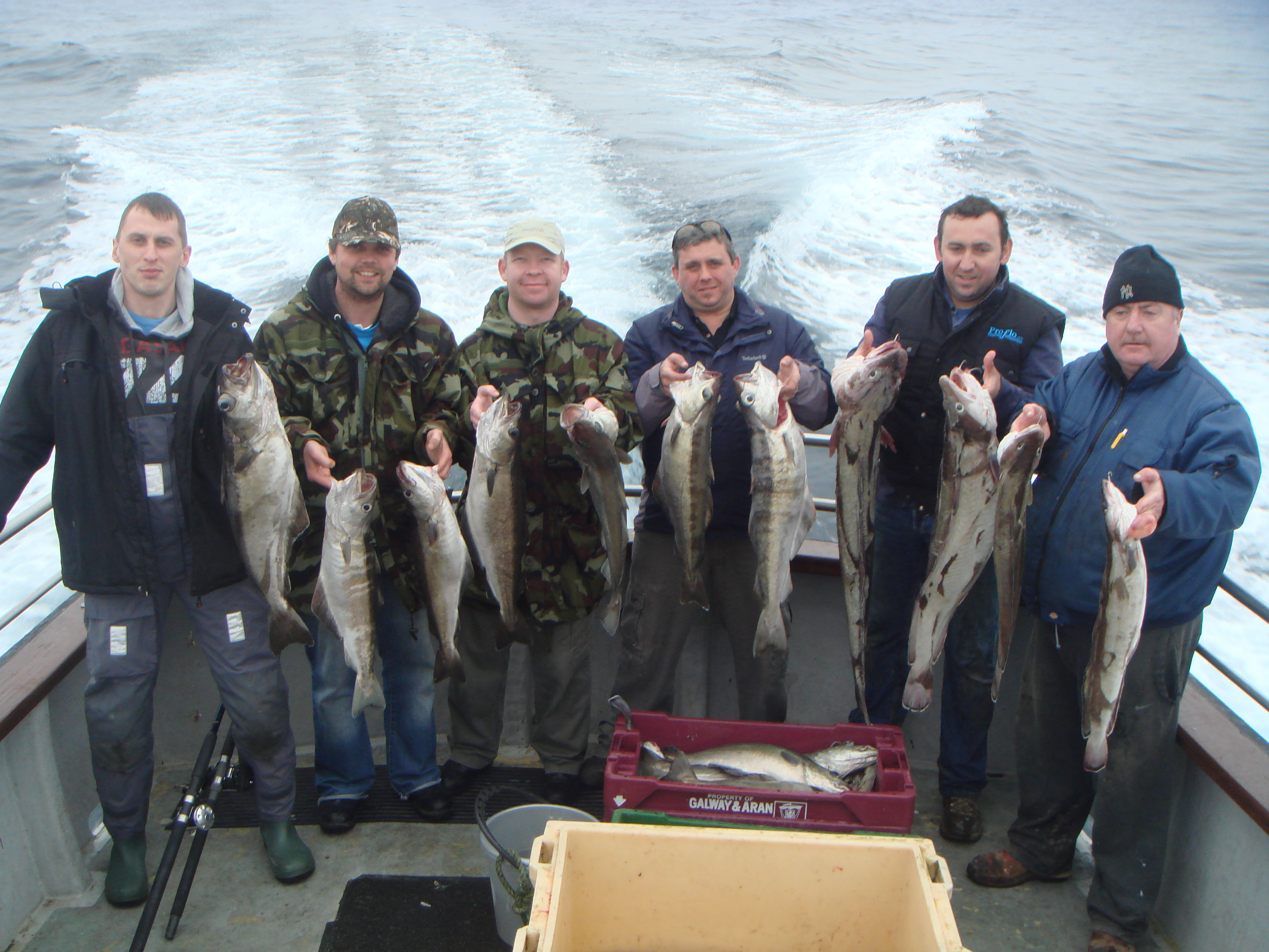 Happy anglers with plenty of fish
