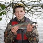 Young boy with rainbow trout