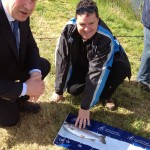 Minister Fergus O Dowd measuring one of the five fish that Peter caught with Peters carer