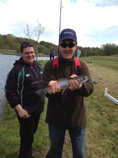 Peter of L’Arche Community Callan with a lovely rainbow trout at Mount Juliet Lake