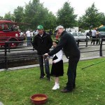 Ashley Hayden explaining fishing to a young lady who caught her first fish – Dace