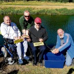 Pat Feeney (Athlone, seated left) and Brian Melville (Navan, seated right) with their trout caught during the Irish Wheelchair Association fishing competition on the Grand Canal at Lucan, with organiser Godfrey Donohue (standing) and Dick Warner (right).Photograph: Liam Kane
