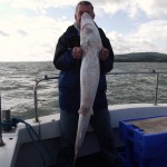 6 foot 2 inch tall my Father holds his 5 foot 3 inch fish up.