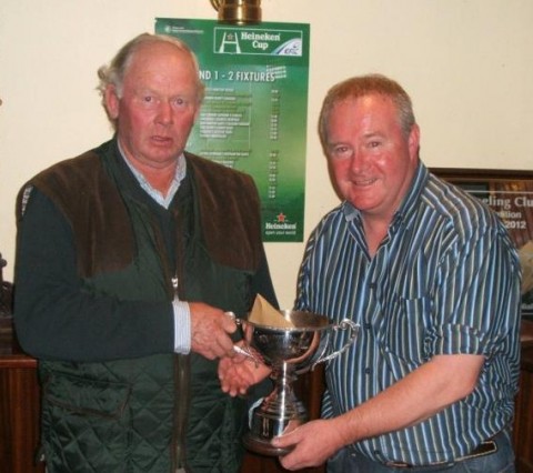Liam Gilsenan recieving the Knockeyne Cup from John Tyrrell