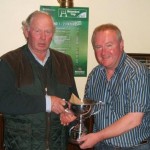 Liam Gilsenan recieving the Knockeyne Cup from John Tyrrell.