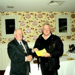 Being presented with a prize by IFSA President Pat Walsh