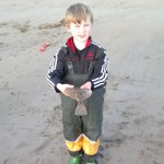 Matthew Curtin with Flounder just caught by his father Michael at our Competition on Lahinch Beach last week. Photo James Linnane