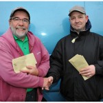 Colin Oliver being presnted his winnings for runner up in the Waterways Ireland King of the Barrow festival by Carlow C.A.C. chairman and National Federation (N.C.F.F.I.) Exec comm. member Gerry McStraw