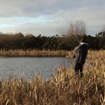 Playing a double figured pike on bog lake