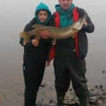 Paddy Ashe with his son and winning fish