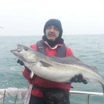 Dr Kamran Shah with his specimen coalfish