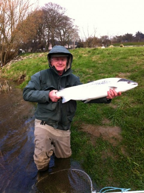 Kevin Clayton has time for a quick photo before returning his salmon