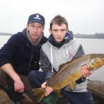 Des Chew and 16 year old Eric Cahill pose with the 12lb trout before releasing it back to the lake. Eric is our "Catch of the Week" winner. Well done, a fine fish.