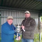 Ollie Mahedy on right receiving the Rex Beaumont Cup from John Tyrrell.