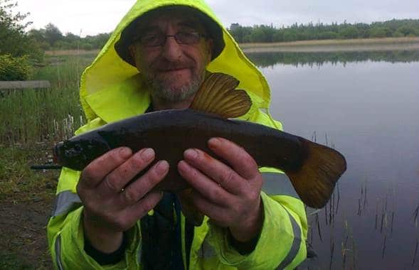 Kazimierz Wojtczak with a nice tench on one of the scenic East Clare Lakes last Sunday morning