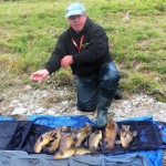 Ian Davis from Liverpool pictured with some of his Tench catch.