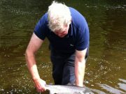 A nice 5lber caught but water levels make fishing difficult at Ballyduff Salmon Fishery Ballyduff Bridge Salmon Fishery - Able ghillie Len Tomlinson returning John Tarbetts Ballincurrig fish.