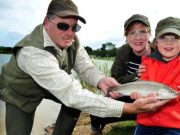 Totally hooked: catching dinner on the fly – Irish Times Garrett Ruigrok from Courtlough Trout Fisheries in Balbriggan, Co Dublin, with Alanna Gallagher and Sonny (6). Photograph 2 Aidan Crawley