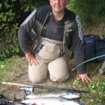 A chuffed Mike Devine kneels beside some of the days catch.