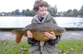 8-year old fishing fanatic Daniel Heaney wtih his 14lb 4oz Common carp