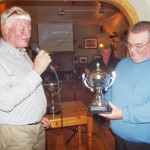 Damian  gives the Jolly Swagmen Sea Trout Cup to Paul Lawton