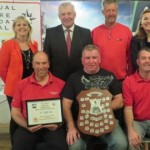Attending the Small Boats Festival in Co Wexford (back row, from left): Orla Woods, Fáilte Ireland; Minister Fergus O’Dowd; John Belger (UK); Josie Mahon, Inland Fisheries Ireland. Front row: winning team of M Rayner, S Shults and N Murphy