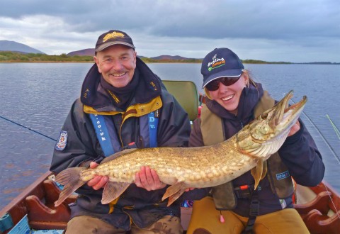 Angling guide Kenny Sloan and Christin Breuker with a lovely pike on fly.