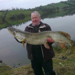 Brian O'Donnell holding a super 31 lb. pike