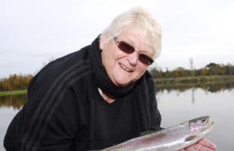 Southern Sue from the land downunder enjoys the rainbows in Mullingar South Australia Ladies Angling club member Sue Atkins pictured with a beautiful rainbow trout