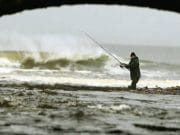 Stormy weather plays havoc with fishing on the Drowes A photo taken by photographer John Mc Vitty of an angler battling the elements at the Sea Pools on New Year’s Day which appeared in yesterday’s Irish Independent.