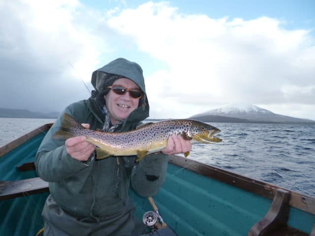 Ballina angler, Joe Quinn with his fine 3.2 lbs. early season brown from Lough Conn. (Joe wears a floatation jacket)