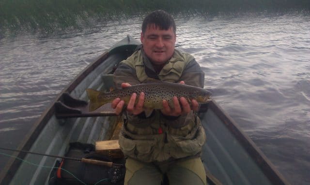 Mac Walsh with a fine Wild Brown Trout from Lough Fern