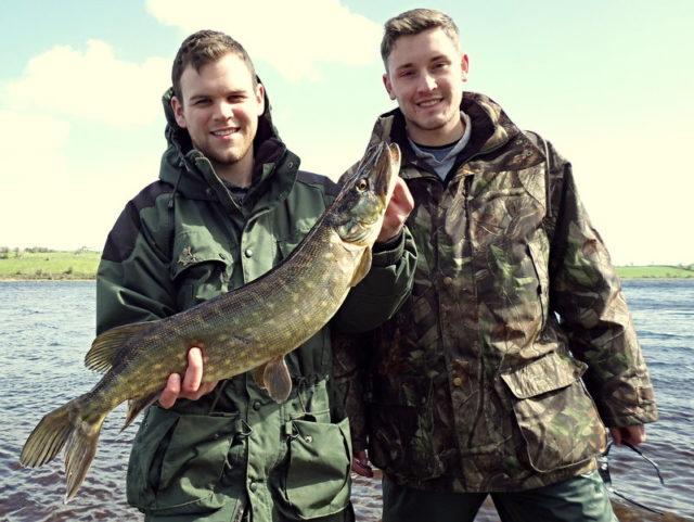 Happy US visitors, Will Rinehart & Andrew Lindley, with one of their fly caught Mayo pike