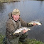 Mick with two trout.jpg0