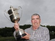 Ollie Dooner wins the Rex Beaumont Cup on Ennell Dooner on song on Ennell. Ollie dooner pictured with Rex > Beaumont Cup.