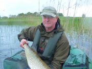 Fly-caught pike while float tubing in Co. Mayo Andy Bowman, Scotland, with one of many fly-caught pike while floattubing in Co. Mayo