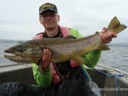 Tropical conditions on Corrib means ferox fishing Marek Kozinski with a beautiful 86cm ferox trout from Lough Corrib, taken while fishing with guide Tomi Kurman, June 2014