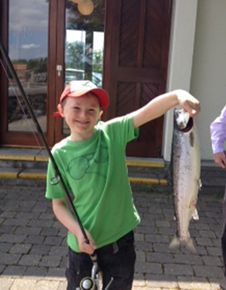 Young Sean Murphy, aged 10,  from Galway, with his first salmon, taken on the Galway Fishery on Sunday June 29th. Sean is from a fishing family, with dad Eugene, uncle Adrian and grandad Fintan all regular visitors to the fishery.