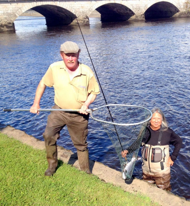 Declan Hughes landing a grilse for John Rocha on the Ridge Pool