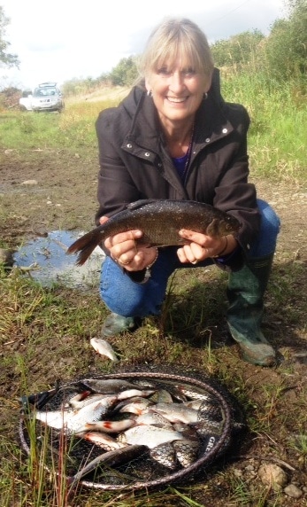 Carol with a mixed catch of Hybrids, Roach and Perch