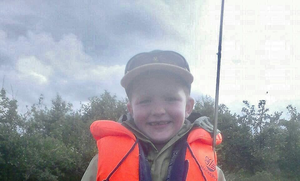 8 year old Cormac Murphy, from Coghans, with a nice trout he caught while fishing on Lough Conn with dad Adrian and brother Brendan