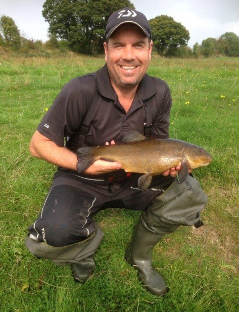Phil with a nice Tench from his catch