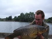 Catching a Cork carp by Bill Brazier Bill with a gorgeous mirror from the Lough